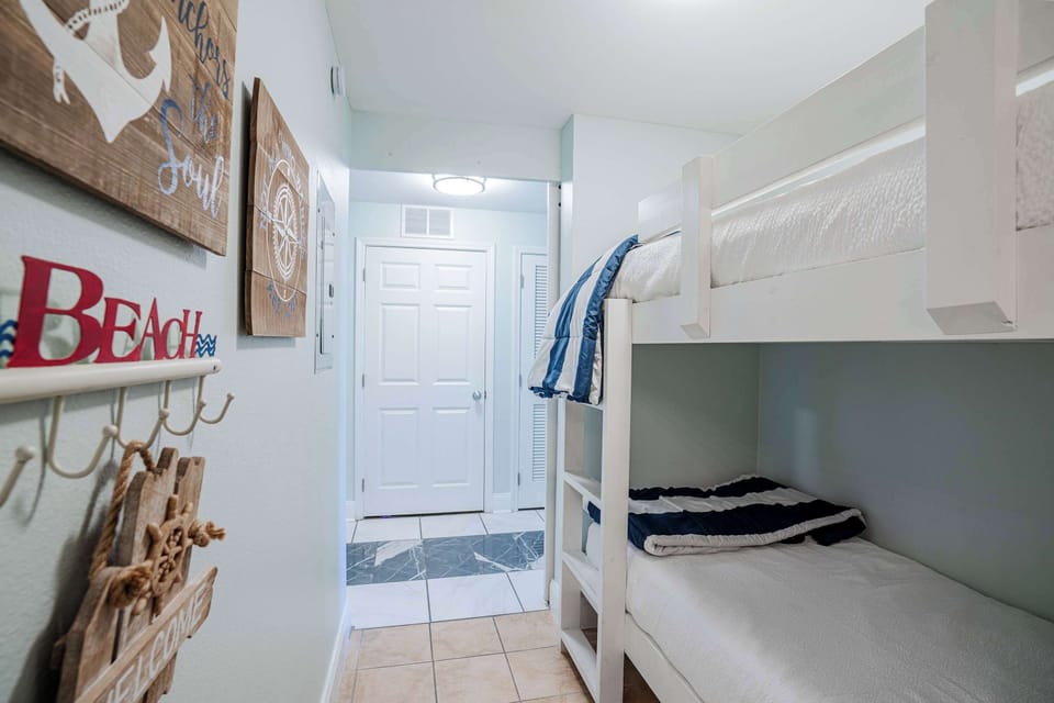 Hallway bunk beds near the bathroom — perfect for kids