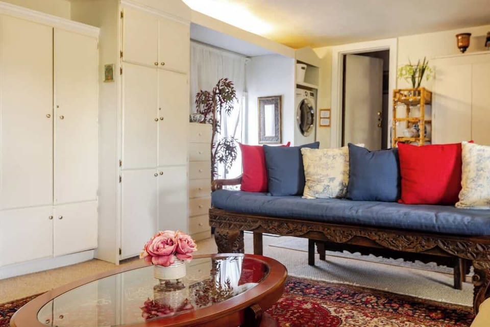 Inviting living area with elegant furniture, colorful accents, and a comfortable place to relax.
