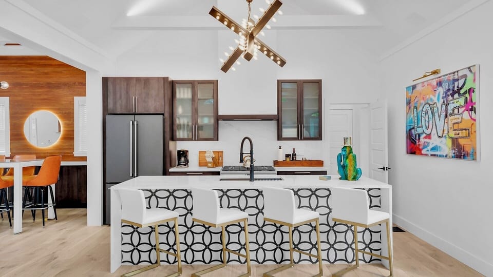 The stylish kitchen island, with four additional seats...