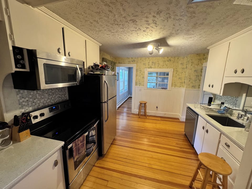 full kitchen: dishwasher (new), sink disposal, smooth surface electric range
