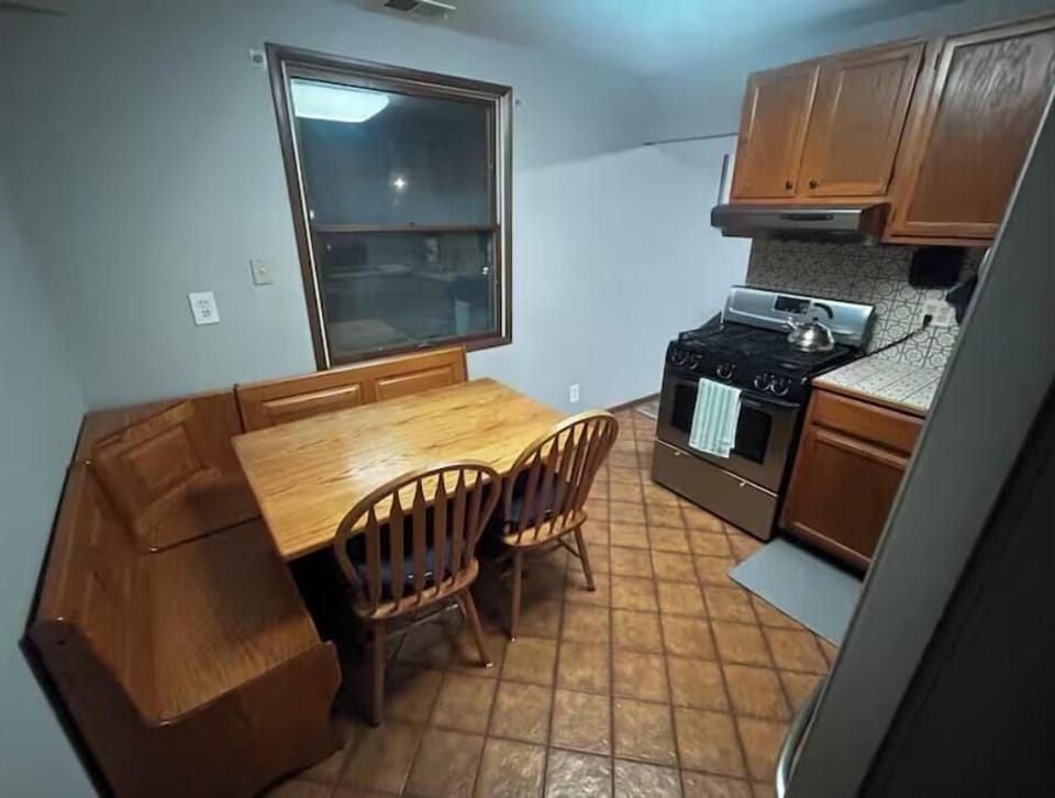 Cozy kitchen with a built-in breakfast nook.