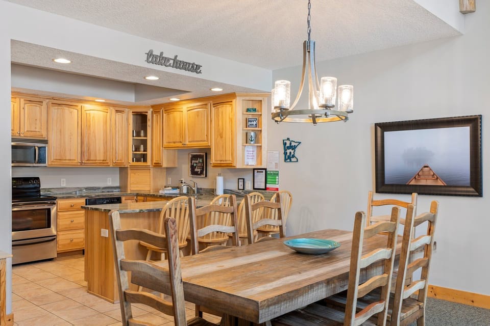 Gather around your spacious dining table for memorable meals while the chef works in the fully-equipped kitchen nearby.