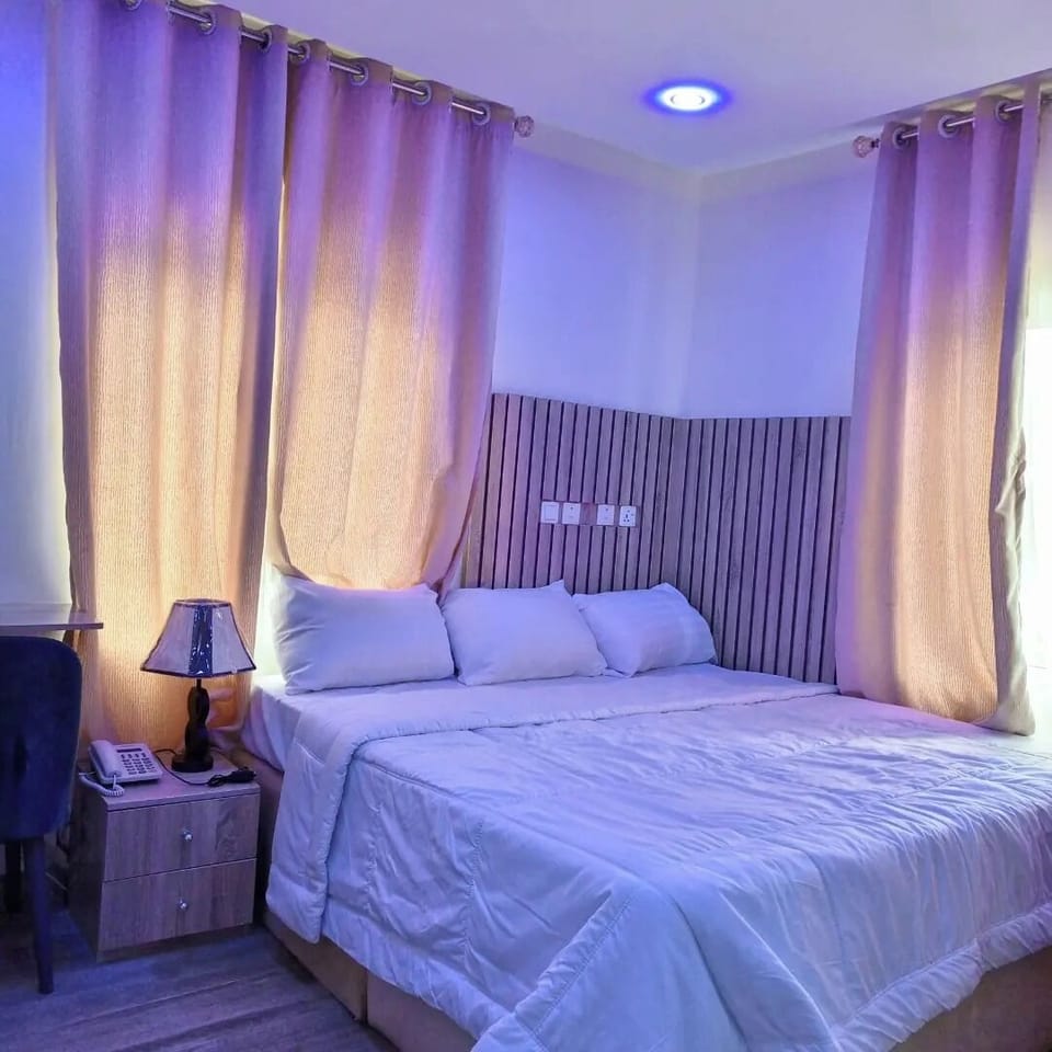Luxury Apartment, Balcony, City View | Desk, laptop workspace, blackout drapes, soundproofing