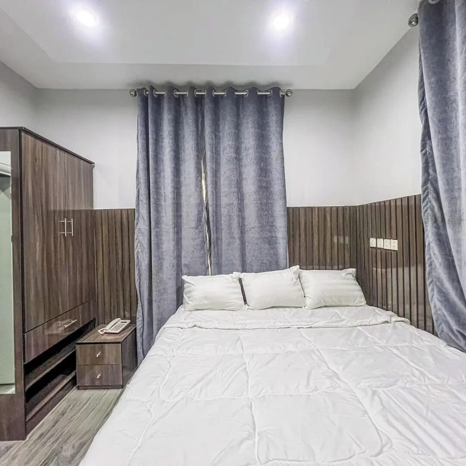 Deluxe Apartment, Balcony, City View | In-room safe, desk, laptop workspace, blackout drapes