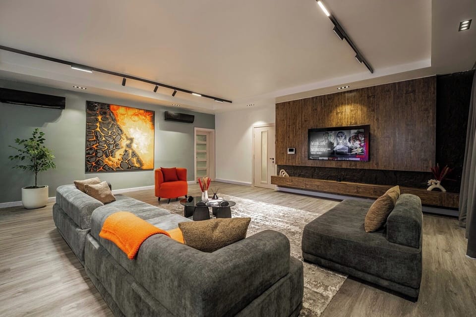Economy Apartment, Balcony, City View | Living area | Flat-screen TV