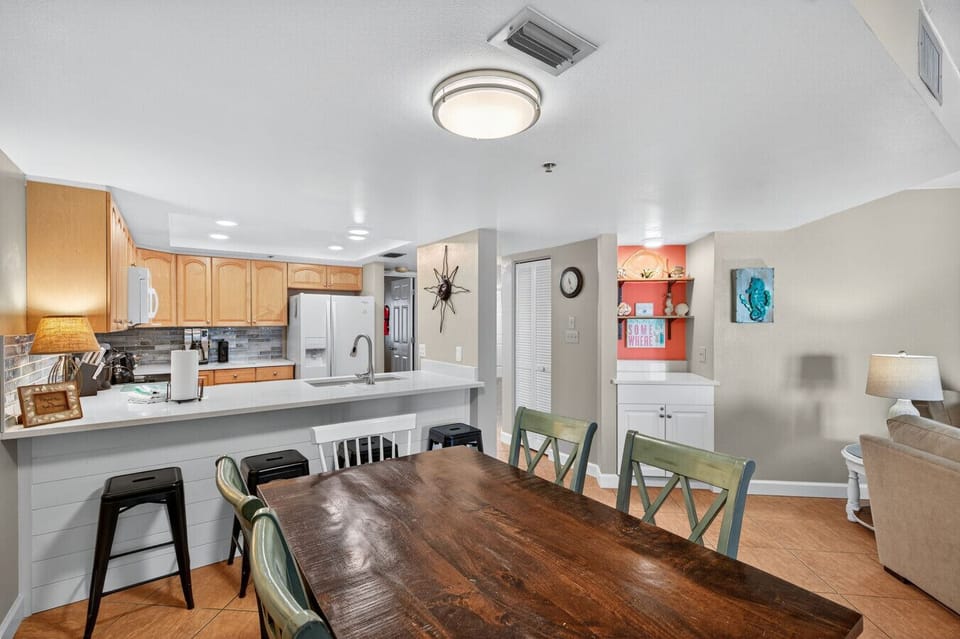 Kitchen & dining area w/ wood table seating and a smooth flow for shared meals.