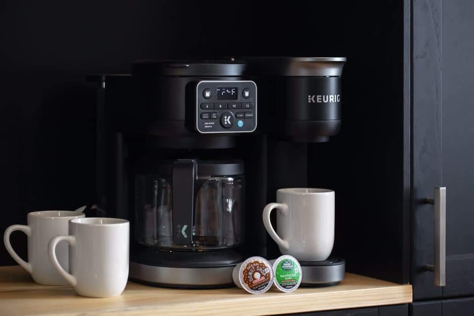 Start your mornings at the fully stocked coffee station featuring a Keurig, fresh pods, and mugs. It’s a welcoming convenience guests love during their stay.
