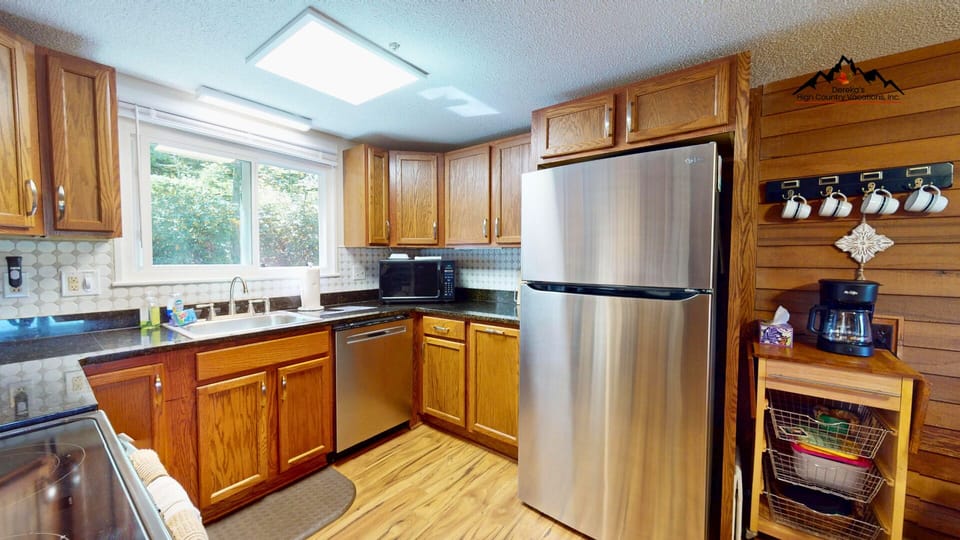 Fully equipped kitchen with modern appliances, ample counter space, and everything needed for cooking meals at home. Clean, functional, and ideal for group or family stays.