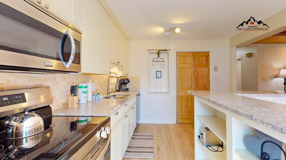 Kitchen with Oven, Dishwasher, Garbage Disposal, and Laundry Closet