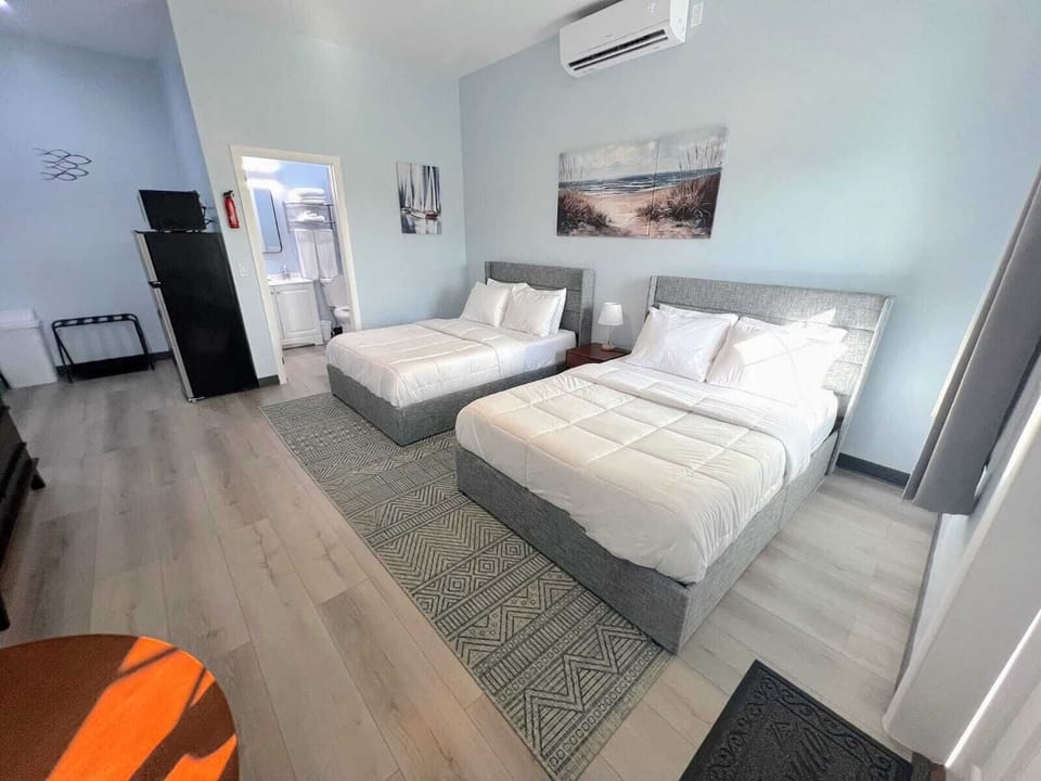 Basic Room, 2 Double Beds | Desk, laptop workspace, soundproofing, iron/ironing board