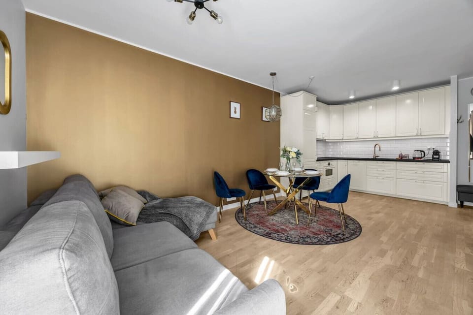Living Room with Sofa Bed, Dining Table and Smart TV | Book Now with RENTUJEMY.COM