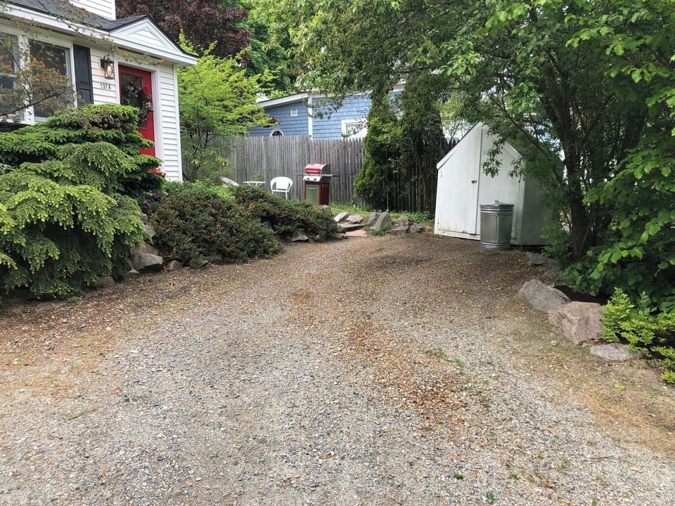 Off-street parking for one vehicle with city-managed hourly parking nearby