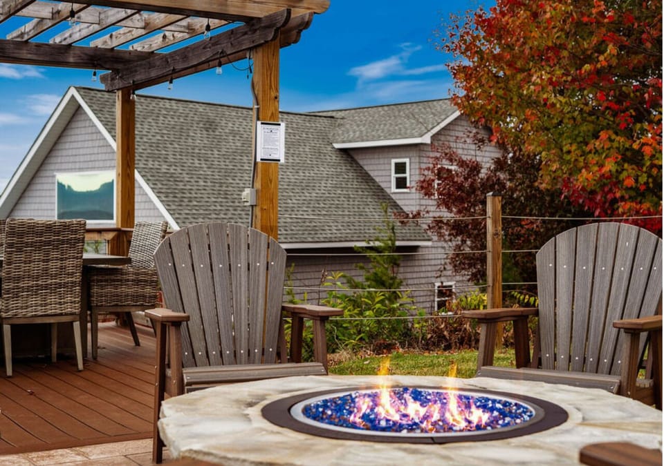Balcony fire pit seating area overlooking beautiful mountain and valley views