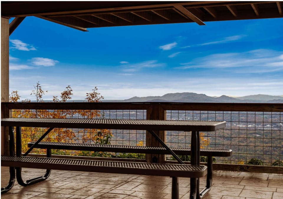 Outdoor picnic table with scenic mountain and valley views
