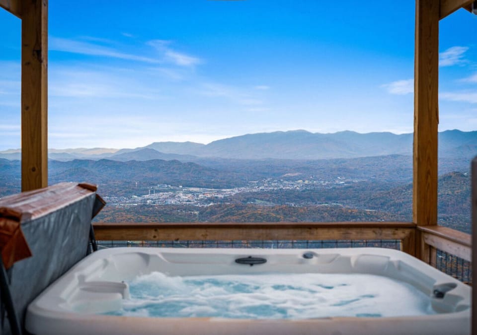 Outdoor hot tub with relaxing panoramic mountain and scenic valley views