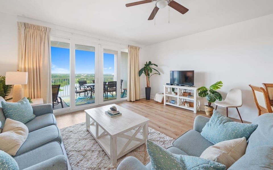 This open area flows seamlessly into the kitchen and dining space and includes a TV for relaxing after a day at the beach.