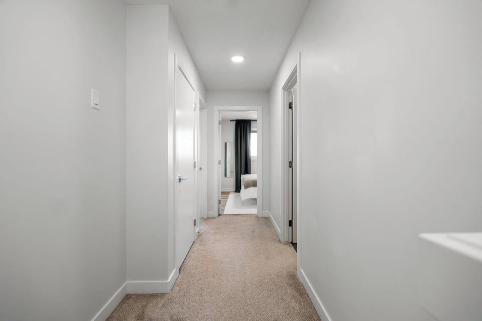 Just down from the master suite—space for the kids or extra guests.