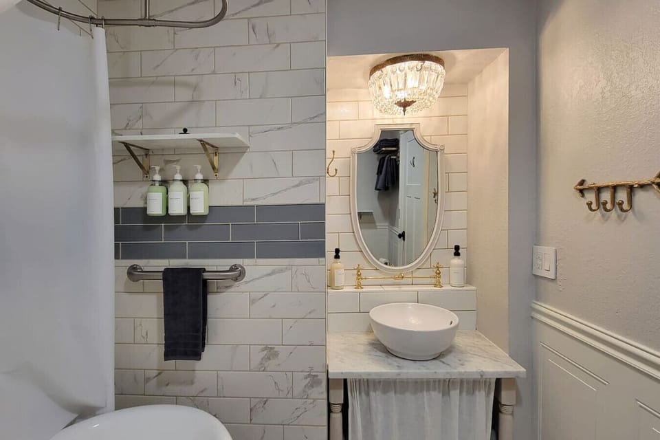 Full bathroom with soaking tub attached to the king bedroom