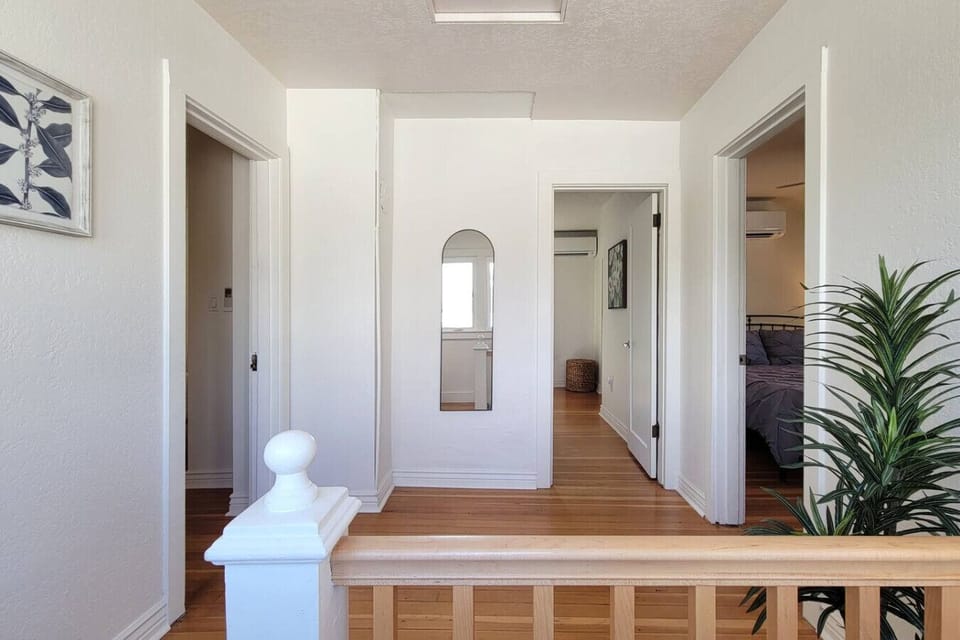 Upstairs landing: king room on the left, bunk bed room in the middle, queen room on the right