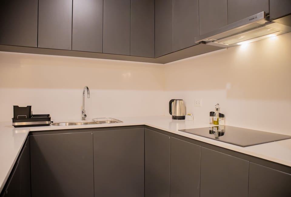 U-shaped kitchen layout, clean and functional with plenty of counter space.