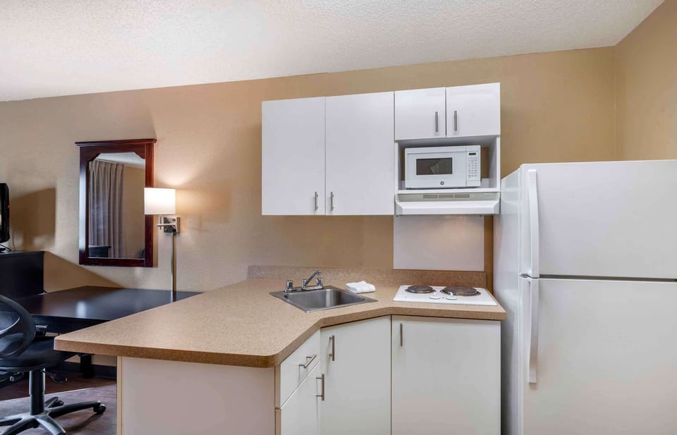 Studio, 1 Queen Bed, Non Smoking | Private kitchen | Full-size fridge, microwave, stovetop, coffee/tea maker
