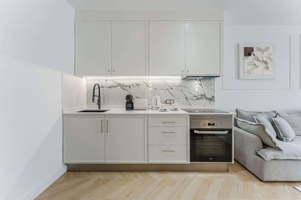Sleek Gourmet Kitchen – Create with Ease Among Marble Surfaces, High-End Appliances and Thoughtful Details