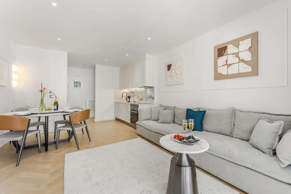 Bright Open Living Area – Sip Bubbly and Share Moments in a Soft, Curated Space with Artistic Touches