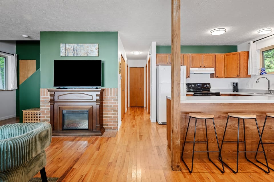 TV in living area with open-concept layout