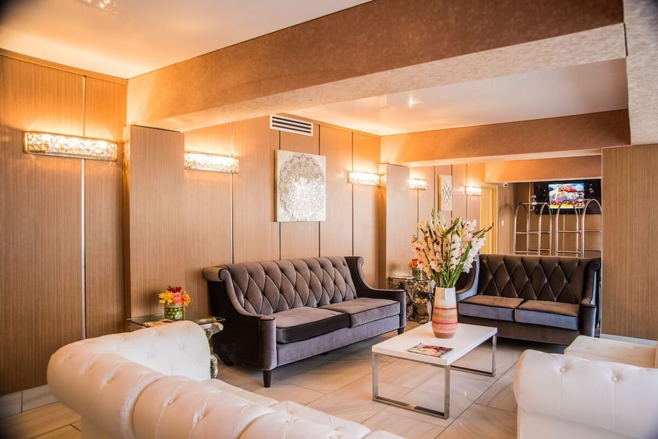 Unwind on plush sofas in a warmly lit lounge.