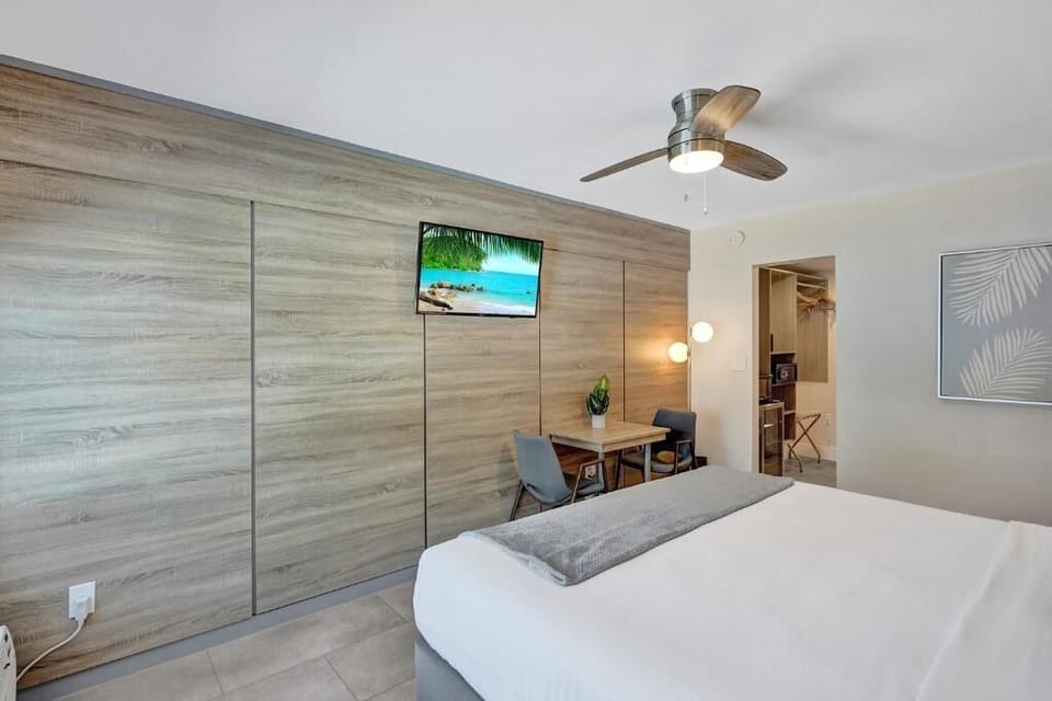 Unwind on crisp linens in a calm, modern room.