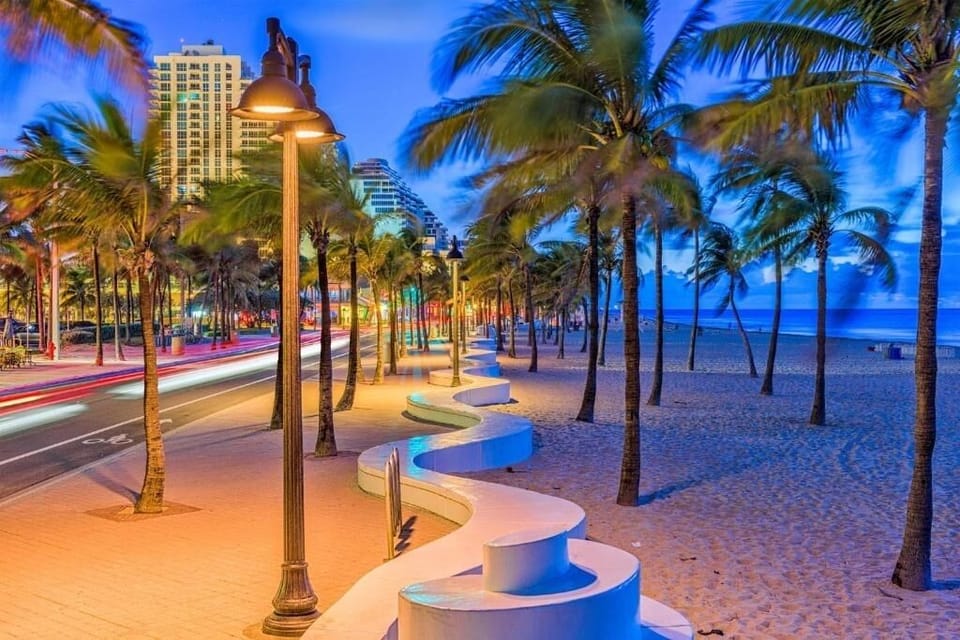 Explore vibrant beachfront evenings with palm-lined seaside promenades.
