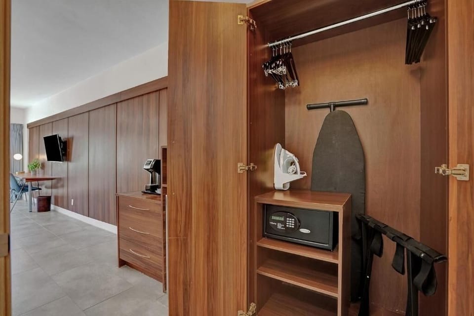 Settle in effortlessly with in-room safe, iron, and storage.