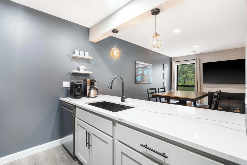 The chic kitchen offers ample space & all the comforts of home​