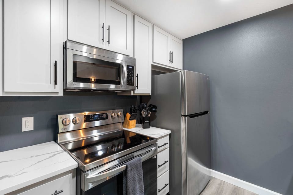 The chic kitchen offers ample space & all the comforts of home​