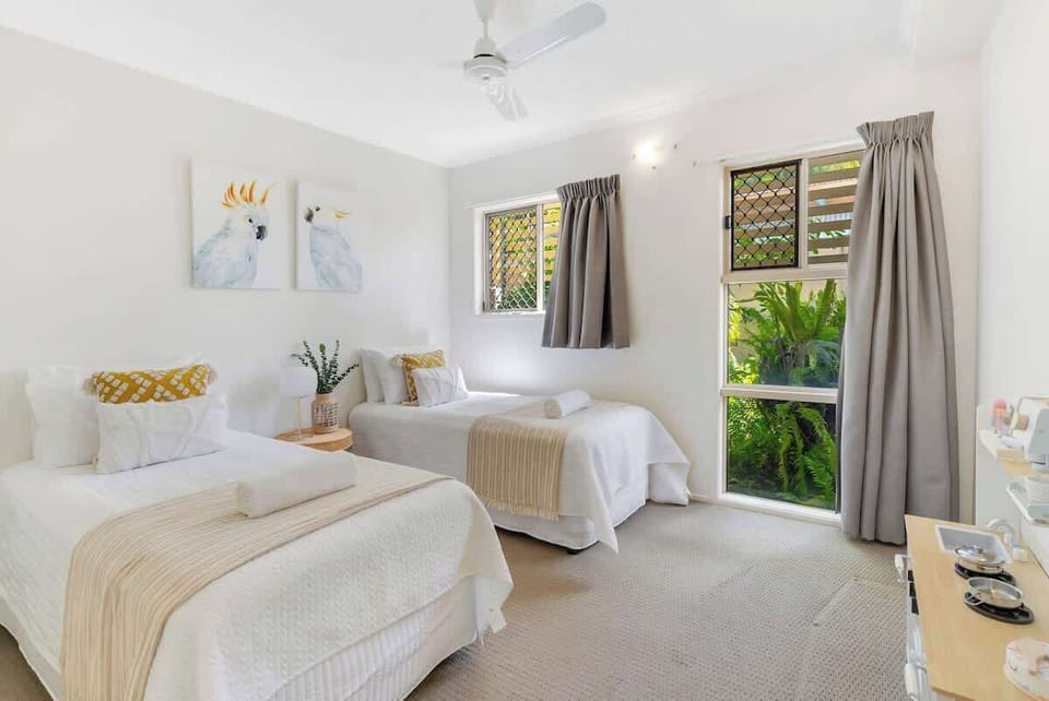 Thoughtfully appointed for those travelling with the kids, the second bedroom is fitted with two king-single beds and a play kitchen set.
