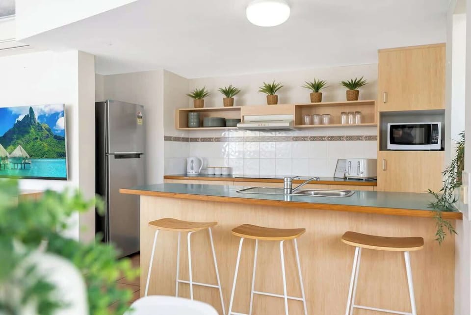 The kitchen comes with everything you’ll need to prepare a meal at home, including an oven, stove, kettle and toaster.
