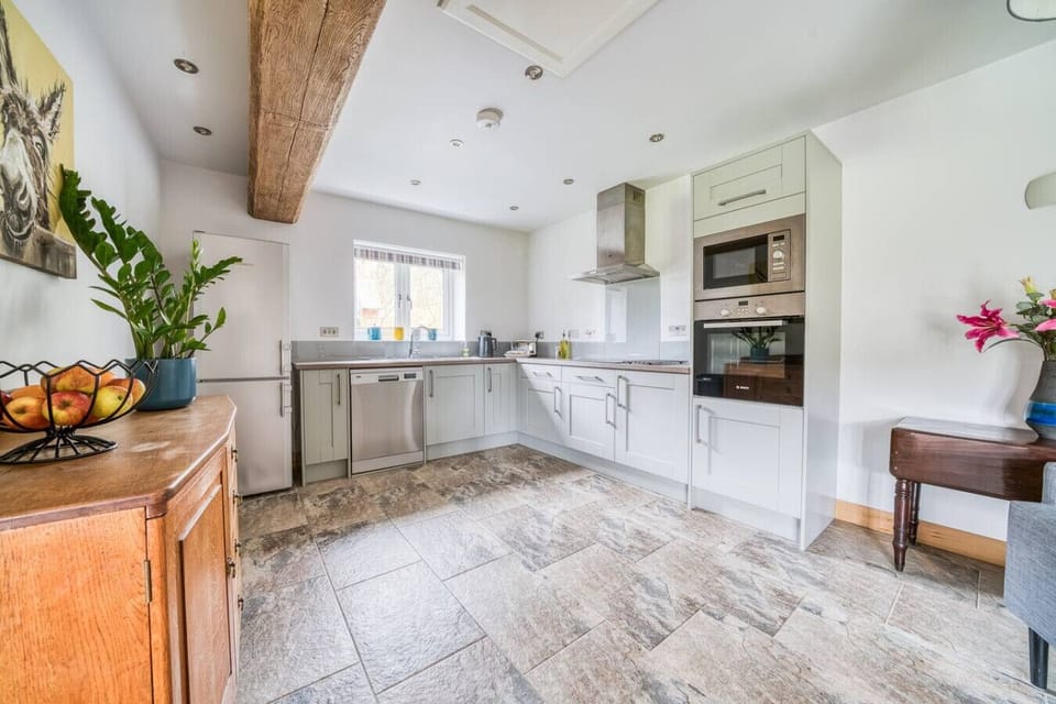 Fully equipped kitchen with bright tiled floor