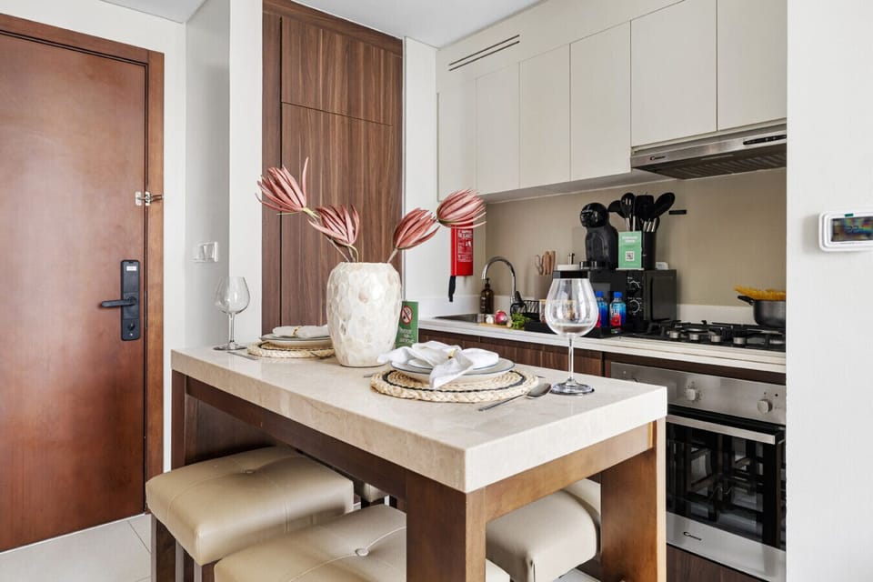 Kitchen and dining area with modern amenities.