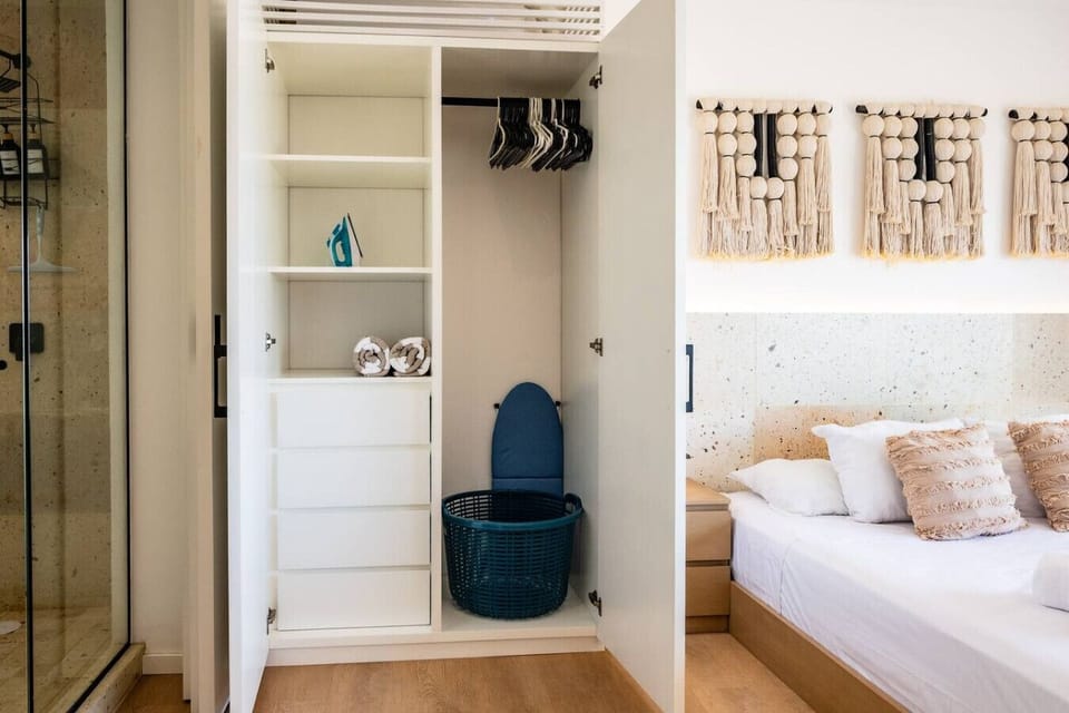 Closet with hangers and shelves for your essentials.