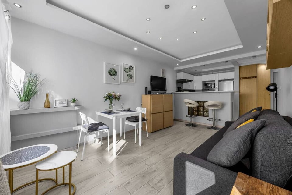 Living Room with Full Sofa Bed, Smart TV and Dining Space | Book Now with RENTUJEMY.COM