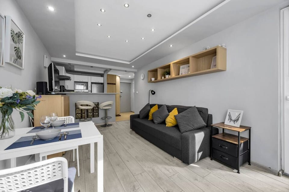 Living Room with Full Sofa Bed, Smart TV and Dining Space | Book Now with RENTUJEMY.COM