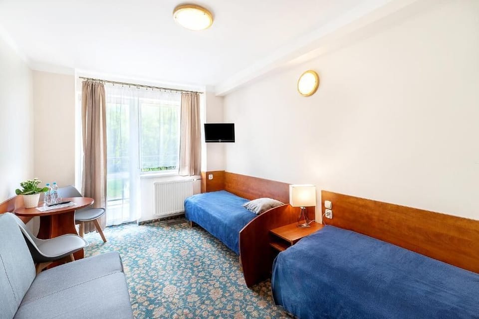 Standard Triple Room, Balcony, Garden View | Laptop workspace, free WiFi
