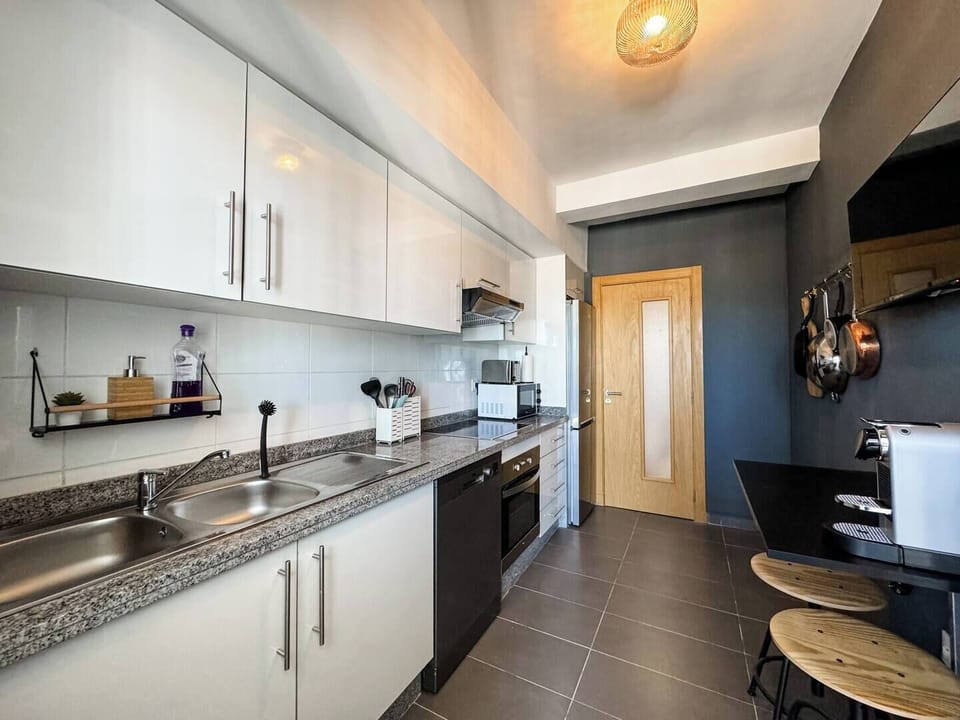 Well equipped kitchen includes dishwasher, oven, microwave, Nespresso machine, toaster, kettle, TV, and more.