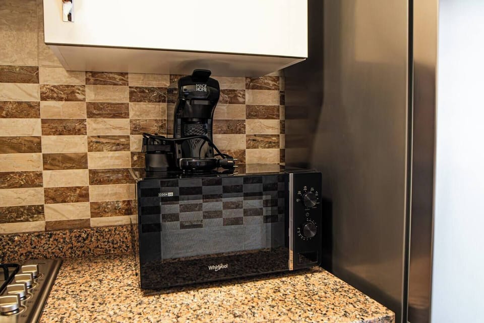 Enjoy your coffee with our coffee machine and heat your meals with our microwave.