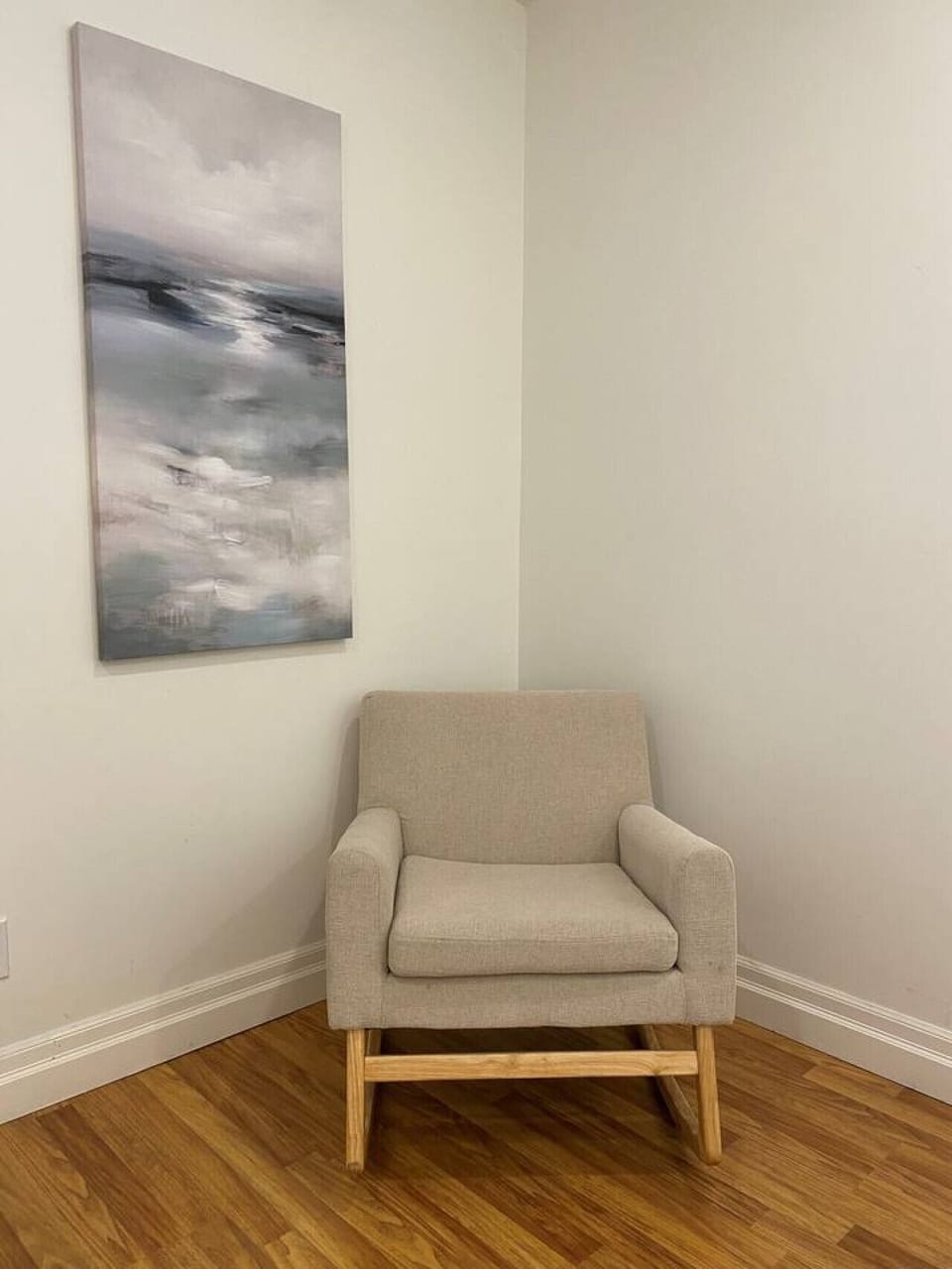 Lower level. Bedroom #3 with queen bed and small chair