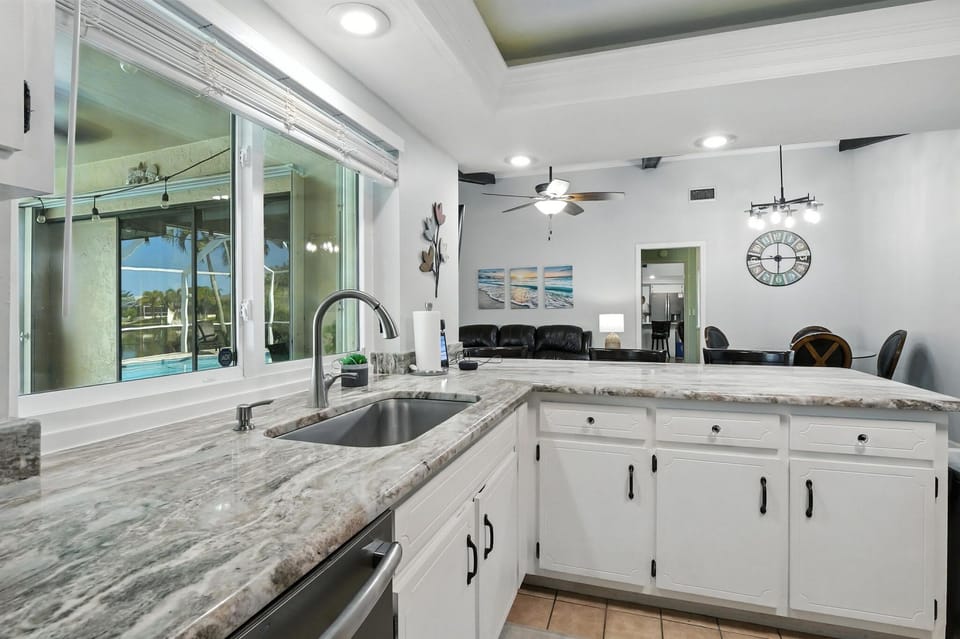 Kitchen window overlooks patio/pool