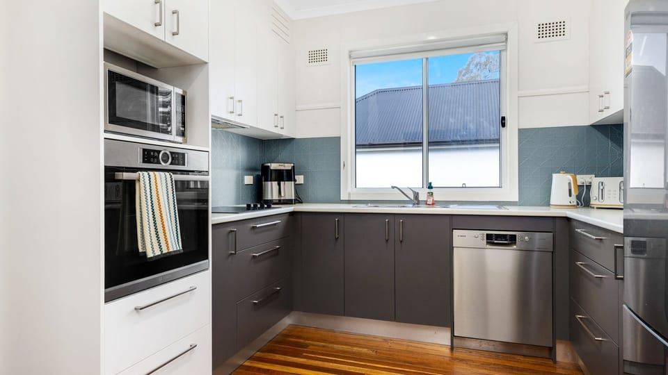 Fully equipped kitchen with modern appliances for home-style cooking.