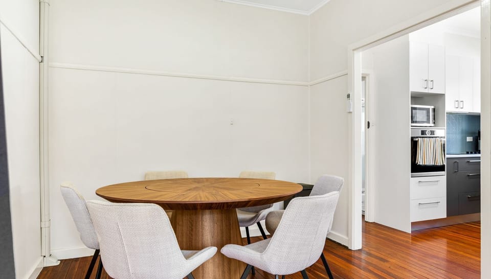 Inviting dining area with a round table, perfect for shared meals.