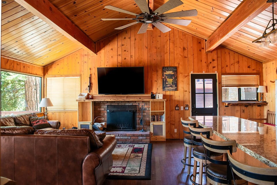 Cozy family room equipped with fire place and TV