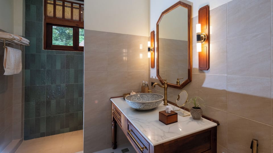 Lakeside Villa - East | Bathroom | Hair dryer, slippers, bidet, towels